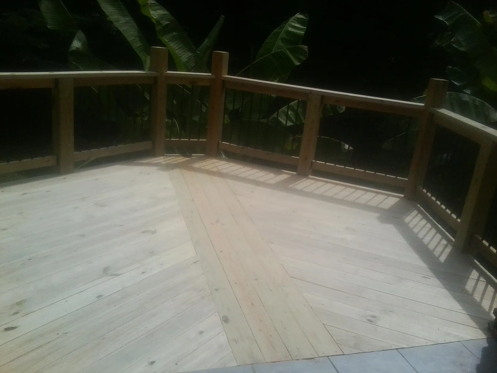 New wood deck and railing built off the back of a home in Bowlus